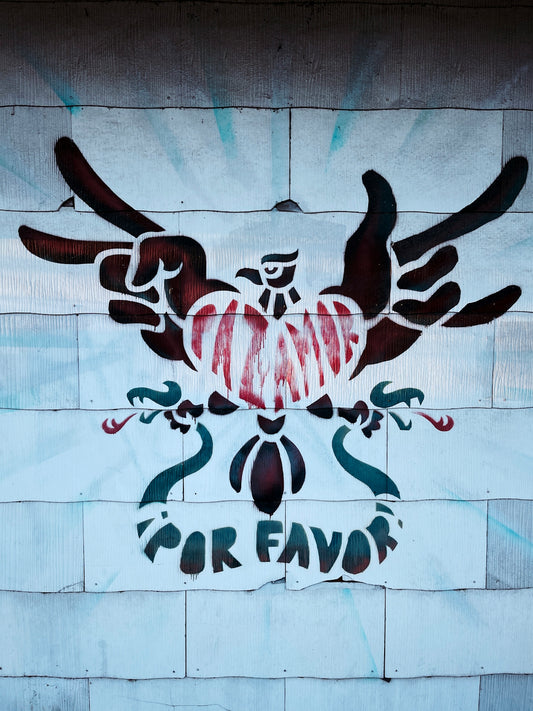 a painted eagle on a brick wall